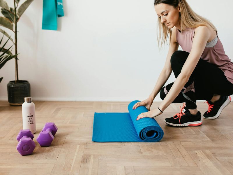 Detailed shot of yoga mat and water bottle in studio