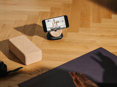 Yoga blocks and strap on a wooden floor